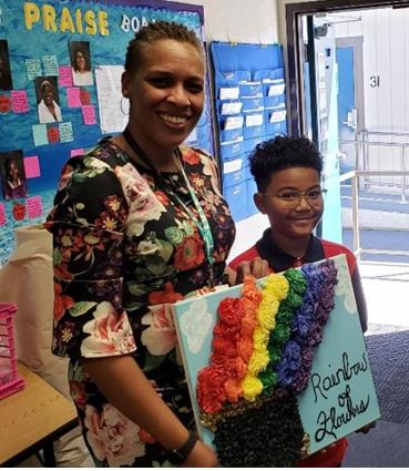 Councilmember Thornton with a student.